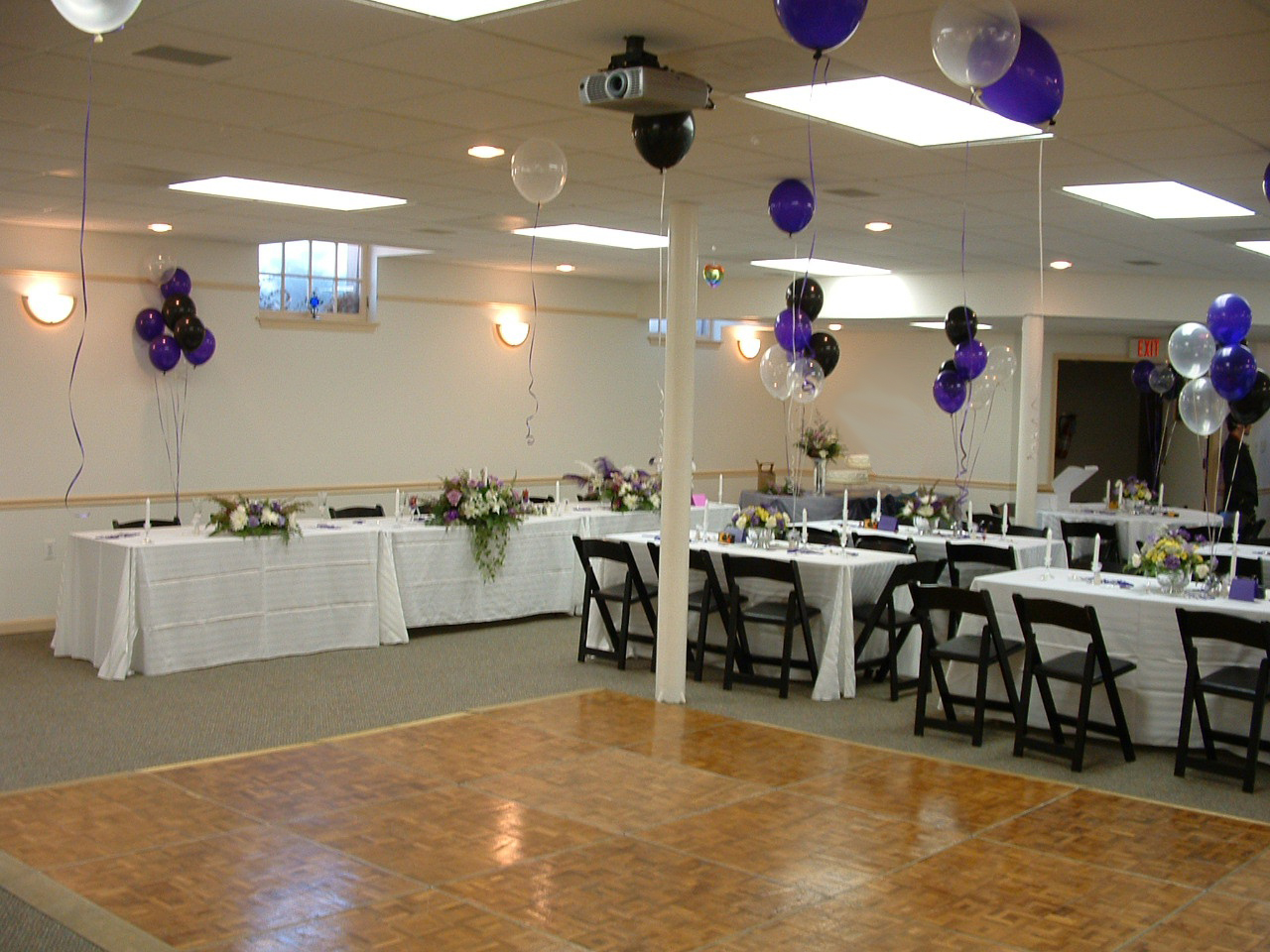 fellowship hall with wedding decorations and dance floor 